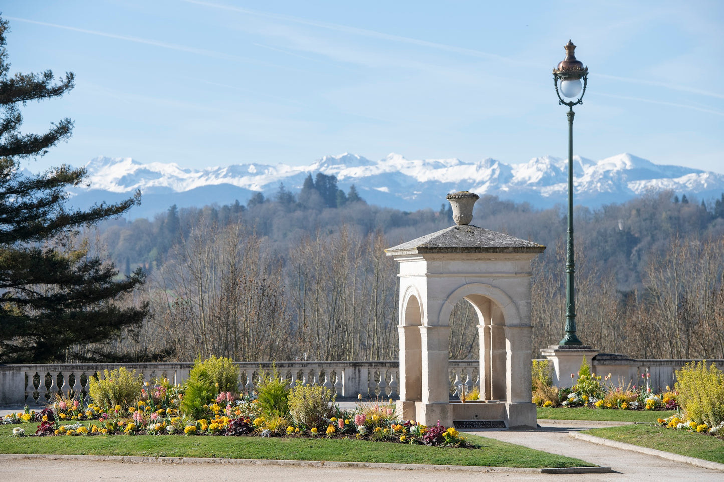 The Vigny fountain and the snow-covered Pyrenees